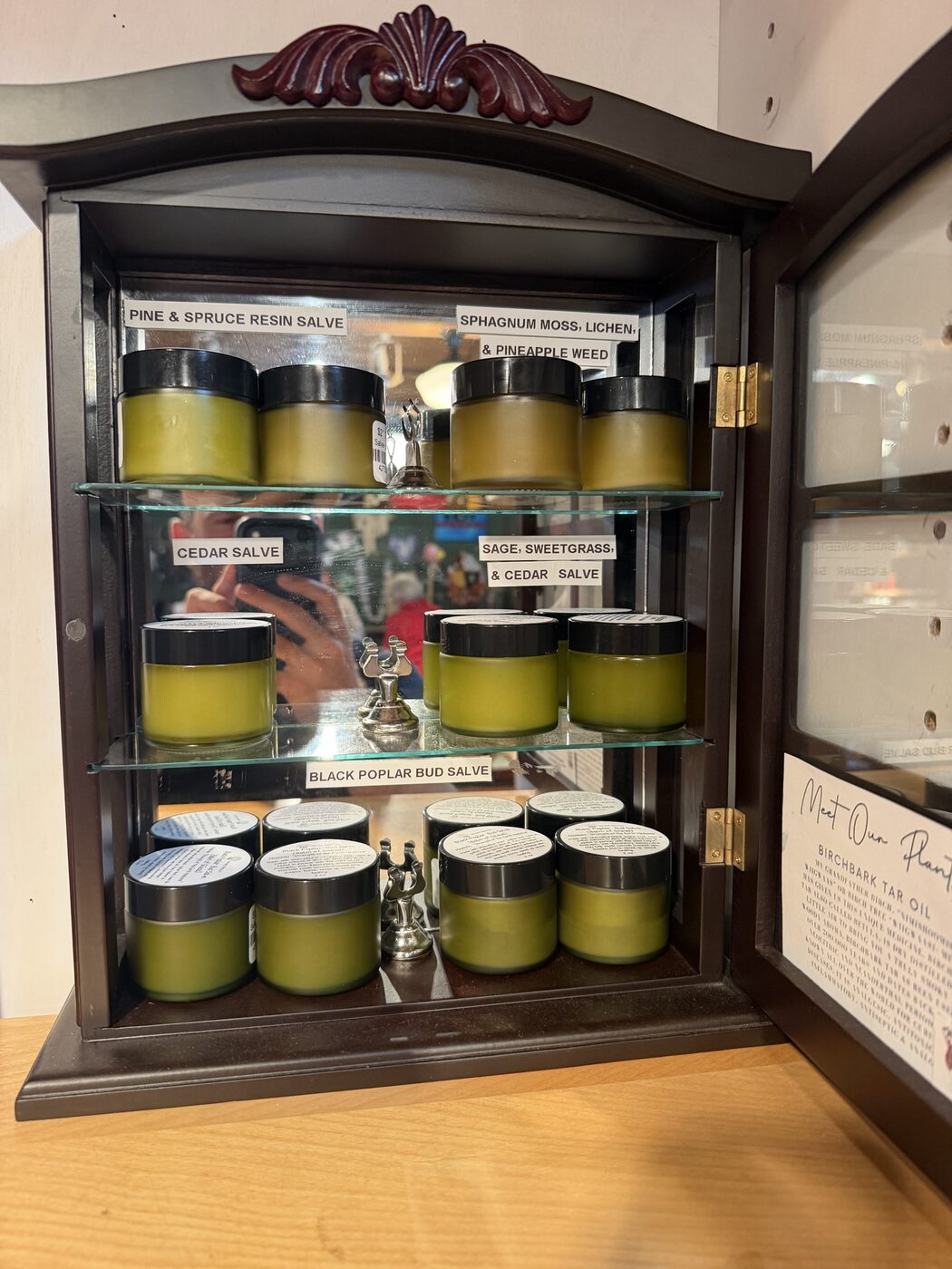 Cabinet of plant salves at the Trading Post