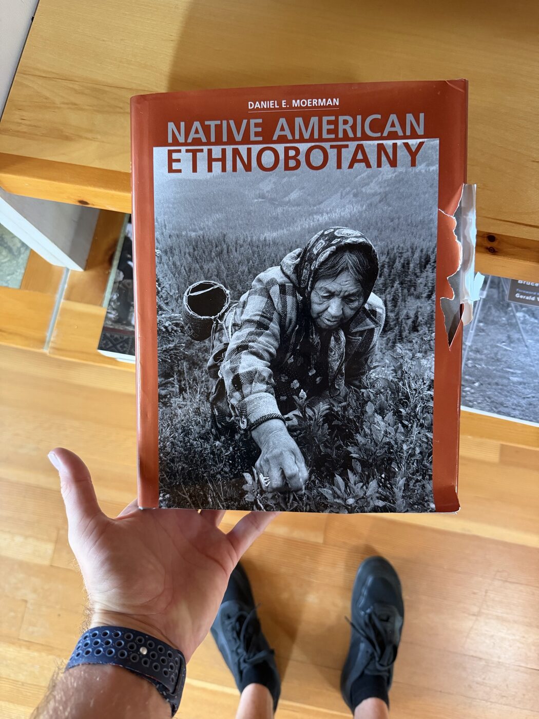 Native American Ethnobotany by Daniel Moerman held in hand